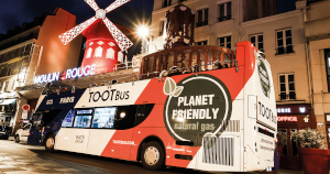 Tootbus night time bus tours outside Moulin Rouge